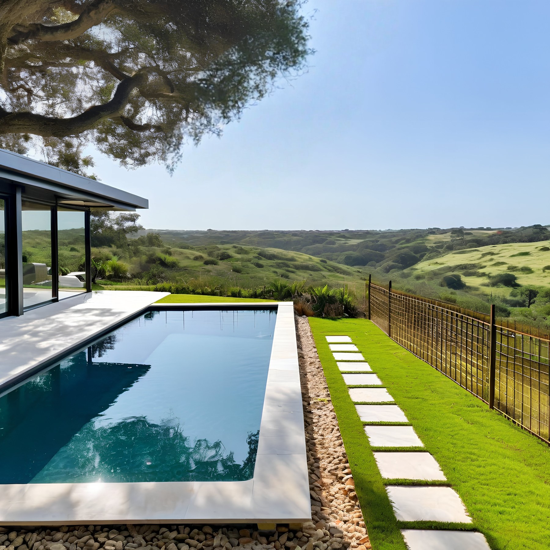 Fiberglass pool overlooking a landscaped outdoor living space